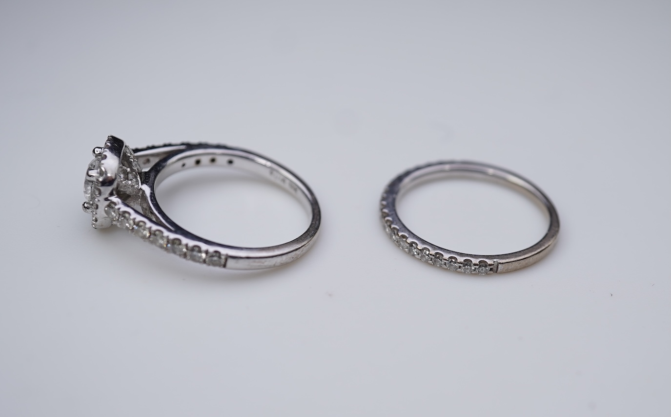 A diamond engagement ring and half eternity ring
